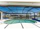 Relaxing pool with screened lanai overlooks the canal for waterfront enjoyment at 1134 Coronado Dr, Punta Gorda, FL 33950
