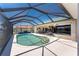 Enjoy the swimming pool inside of a screened enclosure with plenty of patio space at 1134 Coronado Dr, Punta Gorda, FL 33950