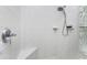 Tiled shower features include bench seating, and a showerhead with a hand-held sprayer at 1134 Coronado Dr, Punta Gorda, FL 33950
