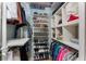 Well-organized walk-in closet with shelves for shoes and storage for clothes at 1134 Coronado Dr, Punta Gorda, FL 33950