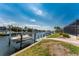 This waterfront home includes a private boat dock and lift and a screened enclosure at 1134 Coronado Dr, Punta Gorda, FL 33950