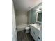 Bright bathroom featuring modern vanity, updated fixtures, and tiled shower at 1258 Barbara Dr # 202, Venice, FL 34285