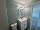 Modern bathroom with vanity, large mirror, and attractive tile details at 1258 Barbara Dr # 202, Venice, FL 34285