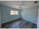 Bedroom features updated wood floors, modern ceiling fan and ample lighting at 1258 Barbara Dr # 202, Venice, FL 34285