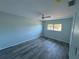 Clean bedroom with hardwood flooring, fan, and windows allowing natural light at 1258 Barbara Dr # 202, Venice, FL 34285