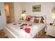 Well-lit bedroom with queen bed and ensuite bathroom access at 1295 Saxony Cir # 2101, Punta Gorda, FL 33983