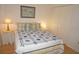 Comfortable bedroom with lamp-lit nightstands on both sides of the bed at 1295 Saxony Cir # 2101, Punta Gorda, FL 33983