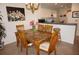 Dining area with table and chairs adjacent to the kitchen at 1295 Saxony Cir # 2101, Punta Gorda, FL 33983