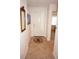 Clean entryway with neutral tile flooring and a decorative rug creates a welcoming first impression at 1295 Saxony Cir # 2101, Punta Gorda, FL 33983