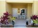 Inviting covered front porch with rocking chairs and seasonal decorations, creating a cozy welcome at 1295 Saxony Cir # 2101, Punta Gorda, FL 33983