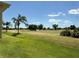 Expansive view of the beautiful golf course, with mature trees and open green spaces at 1295 Saxony Cir # 2101, Punta Gorda, FL 33983