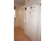White refrigerator with filtered water, adjacent to a storage closet at 1295 Saxony Cir # 2101, Punta Gorda, FL 33983