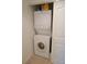 White stacked washer and dryer unit inside of closet with sliding doors at 1295 Saxony Cir # 2101, Punta Gorda, FL 33983
