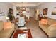 Inviting living room with comfortable sofas and an open floor plan to the kitchen and dining area at 1295 Saxony Cir # 2101, Punta Gorda, FL 33983