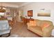 Comfortable living room featuring cozy seating, tile floors, and access to dining area at 1295 Saxony Cir # 2101, Punta Gorda, FL 33983