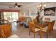 Open-concept living room and dining area featuring tile floors, and a sliding glass door to an outdoor patio at 1295 Saxony Cir # 2101, Punta Gorda, FL 33983