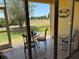 Relaxing screened-in lanai offers a perfect spot to unwind with views of the golf course at 1295 Saxony Cir # 2101, Punta Gorda, FL 33983