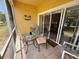 Screened patio features comfortable furniture and lovely views at 1295 Saxony Cir # 2101, Punta Gorda, FL 33983