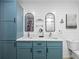 Bathroom featuring dual sinks, stylish mirrors, and a toilet at 1318 Wesley Dr # 7, Punta Gorda, FL 33950