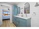 Bathroom featuring dual sinks, stylish mirrors, and access to bedroom at 1318 Wesley Dr # 7, Punta Gorda, FL 33950
