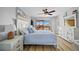 Inviting bedroom with a comfortable bed, ceiling fan, and access to outdoor balcony at 1318 Wesley Dr # 7, Punta Gorda, FL 33950