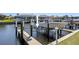 Close up of a boat lift on the water near condo property with seawall at 1318 Wesley Dr # 7, Punta Gorda, FL 33950