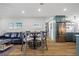 Cozy dining area showcasing wood-look flooring, stylish table with barstool seating, and views into kitchen at 1318 Wesley Dr # 7, Punta Gorda, FL 33950
