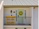 Charming condo entrance with a table and chairs and decorative wreath at 1318 Wesley Dr # 7, Punta Gorda, FL 33950