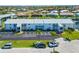 Well-maintained building exterior with ample parking and tropical landscaping at 1318 Wesley Dr # 7, Punta Gorda, FL 33950