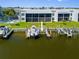 Waterfront condo featuring a private boat dock and a meticulously maintained lawn at 1318 Wesley Dr # 7, Punta Gorda, FL 33950