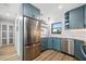 Bright kitchen featuring stainless steel appliances, including a refrigerator and dishwasher at 1318 Wesley Dr # 7, Punta Gorda, FL 33950
