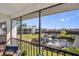 Screened lanai boasts waterfront views of the canal and boat docks, perfect for enjoying the outdoors at 1318 Wesley Dr # 7, Punta Gorda, FL 33950