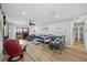 Open-concept living room with a large sofa, dining table and balcony access at 1318 Wesley Dr # 7, Punta Gorda, FL 33950