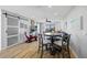 Bright living room featuring a modern dining table, sliding barn door, and comfortable seating area at 1318 Wesley Dr # 7, Punta Gorda, FL 33950
