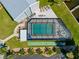 Aerial view of screened-in pool, tanning deck and shuffle board at 1318 Wesley Dr # 7, Punta Gorda, FL 33950