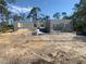 Image of block-built new construction, framed for windows and doors, on a sunny day at 135 Hardee Way, Rotonda West, FL 33947