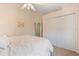 This bedroom offers ample closet space and a soothing color scheme for a relaxing retreat at 13761 Long Lake Ln, Port Charlotte, FL 33953