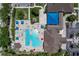 Aerial view of the resort-style pool, seating, and cabanas, providing the perfect place for relaxation at 13761 Long Lake Ln, Port Charlotte, FL 33953