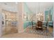 Dining area with a view into the kitchen at 13761 Long Lake Ln, Port Charlotte, FL 33953