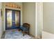 Charming front porch featuring double doors and a cozy bench at 13761 Long Lake Ln, Port Charlotte, FL 33953
