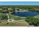 Scenic golf course view with serene water features, lush greenery, and clear blue skies, perfect for recreation at 13761 Long Lake Ln, Port Charlotte, FL 33953