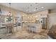 Bright kitchen with updated appliances, an island with bar seating, and a breakfast area with a view at 13761 Long Lake Ln, Port Charlotte, FL 33953