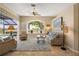 Comfortable living room with a large window overlooking the lake at 13761 Long Lake Ln, Port Charlotte, FL 33953