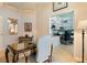 Bright office space with custom built-in shelving and a view into the walk-in closet at 13761 Long Lake Ln, Port Charlotte, FL 33953