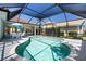 Screened-in pool with seating area, providing a perfect oasis for relaxation and enjoyment at 13761 Long Lake Ln, Port Charlotte, FL 33953