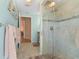 A spacious glass shower with stylish tiling and a showerhead at 13761 Long Lake Ln, Port Charlotte, FL 33953