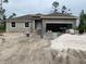 New construction home featuring a modern design with a spacious open garage at 139 Hardee Way, Rotonda West, FL 33947