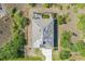 Aerial view of home featuring a screened pool at 15345 Pottstown Ave, Port Charlotte, FL 33981