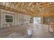 Spacious unfinished basement featuring exposed beams and concrete walls with sliding glass door access at 15345 Pottstown Ave, Port Charlotte, FL 33981