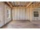 Unfinished basement showcasing exposed beams and cinderblock walls awaiting renovation at 15345 Pottstown Ave, Port Charlotte, FL 33981